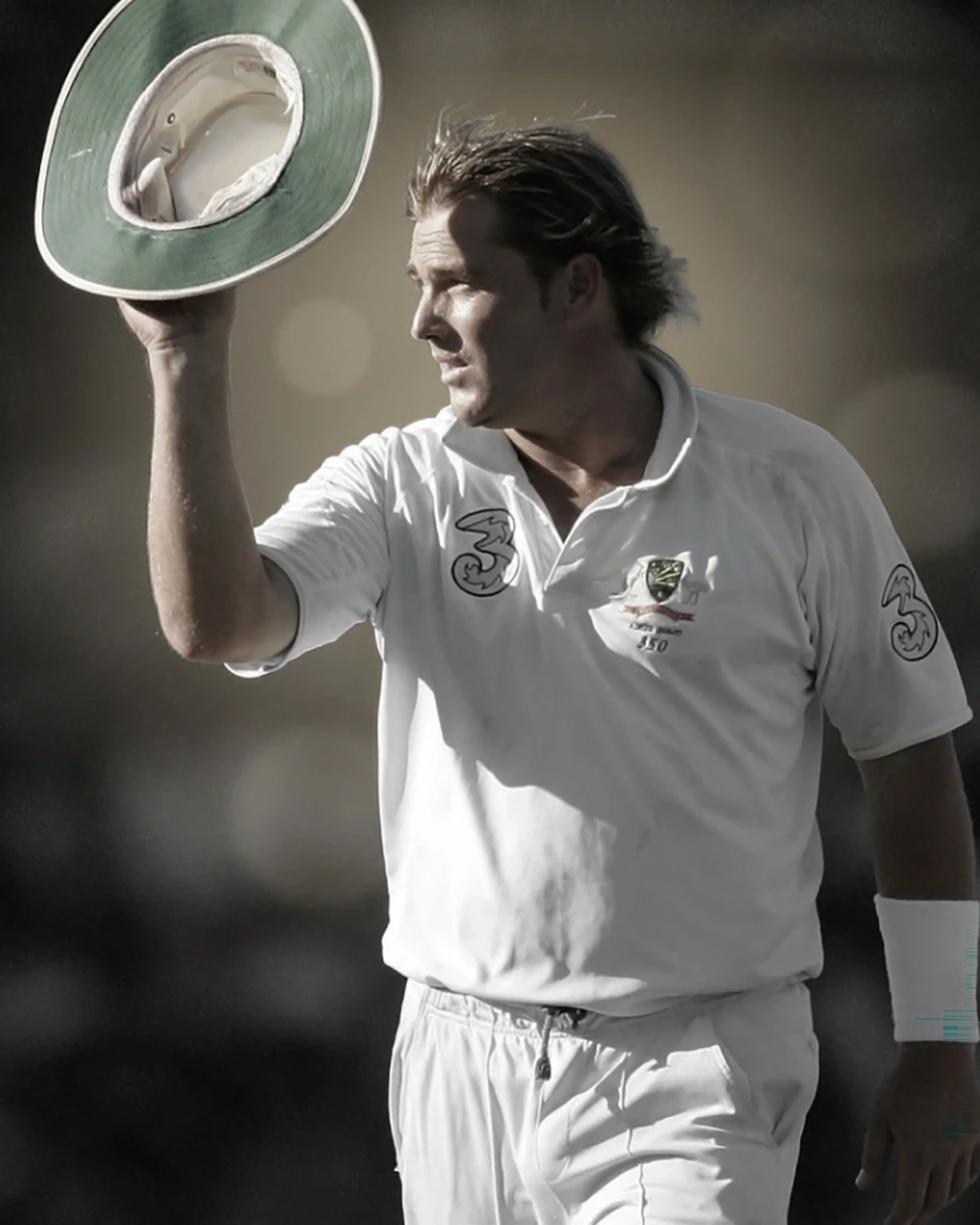 Cricketer Shane Warne tips his hat