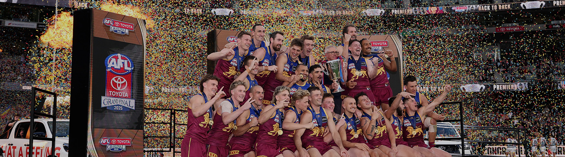 The Brisbane Lions celebrate their AFL Grand Final win