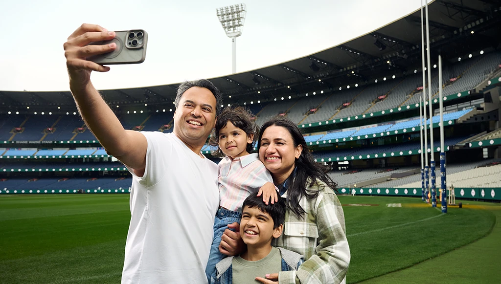 Family next to the boundary line on an MCG Tour