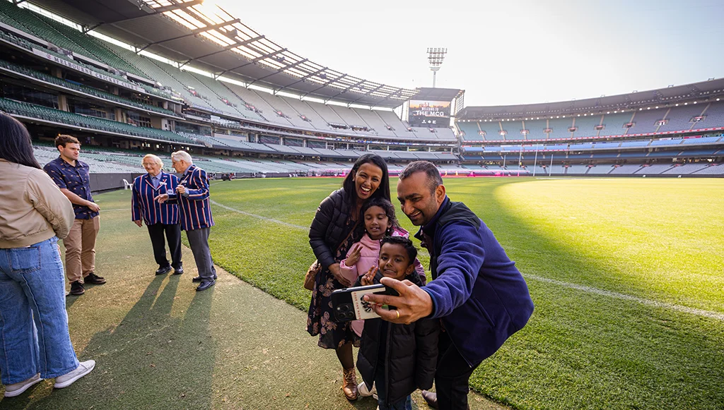 Patrons next to the boundary line on an MCG Tour Patrons next to the boundary line on an MCG Tour