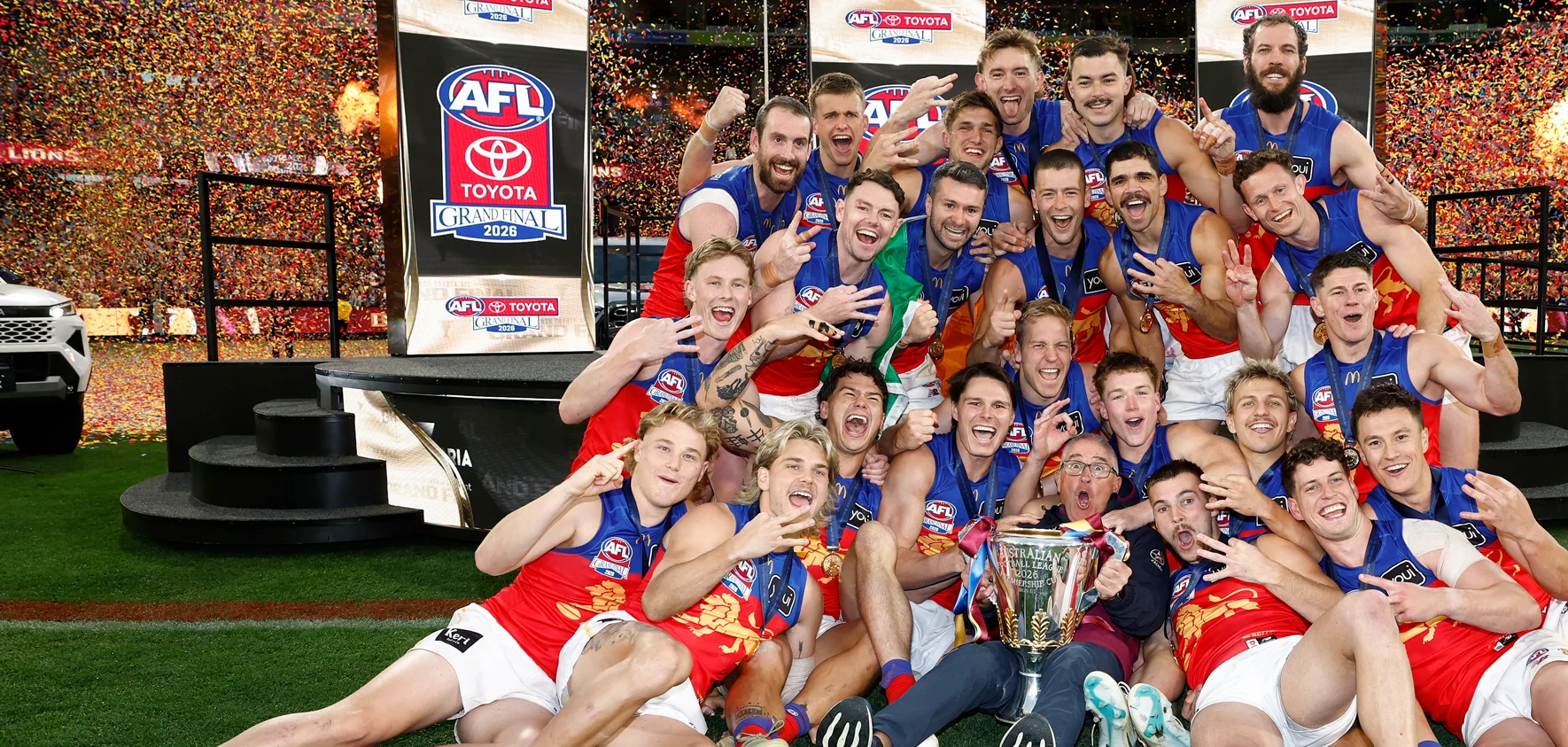 Brisbane Lions team celebrating the 2026 Premiership on the MCG
