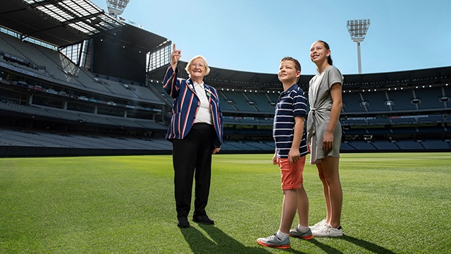 MCG Premium Access Tour An MCG Tour Guide and two children on a Premium Access Tour