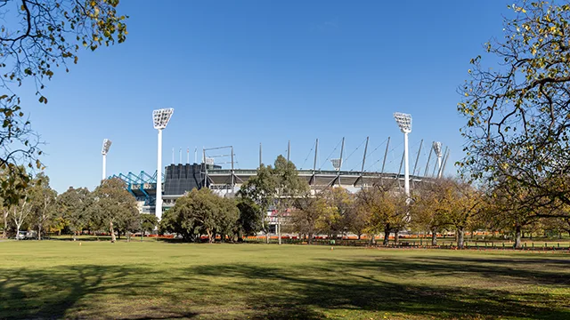 Large parkland in front of the MCG stadium