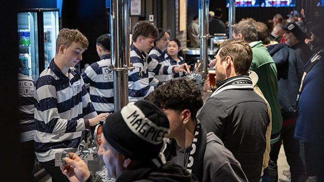 Fans line up to purchase drinks at the Lock Up Bar at the MCG Fans line up to purchase drinks at the Lock Up Bar at the MCG