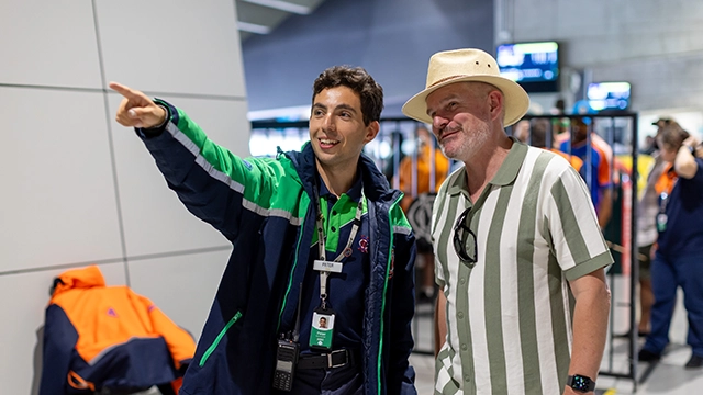 An MCG staff member provides directions for a patron on an MCG game day An MCG staff member provides directions for a patron on an MCG game day