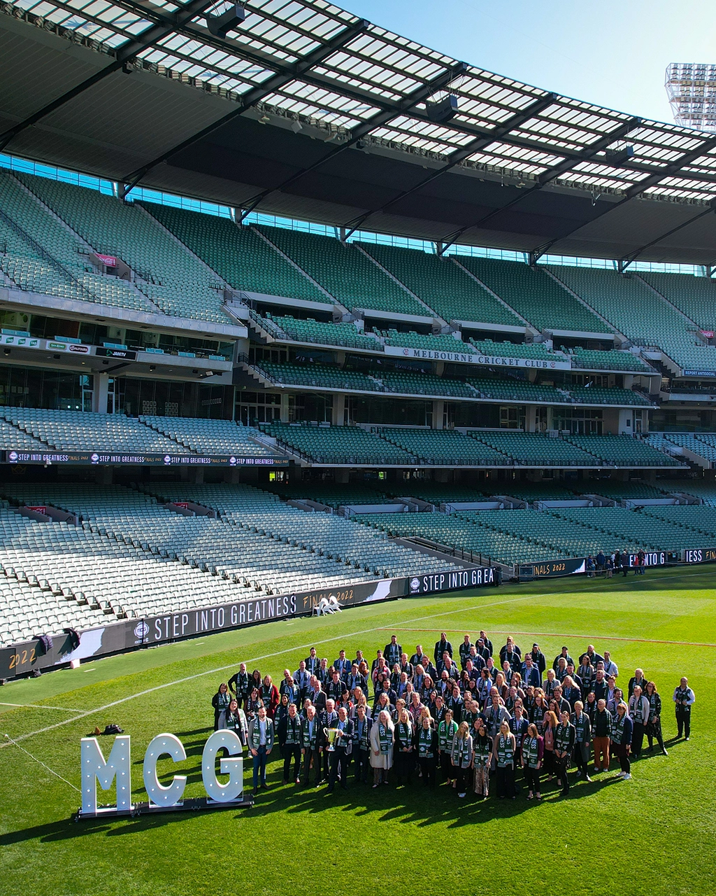 MCG permanent staff stand on the MCG arena MCG permanent staff stand on the MCG arena