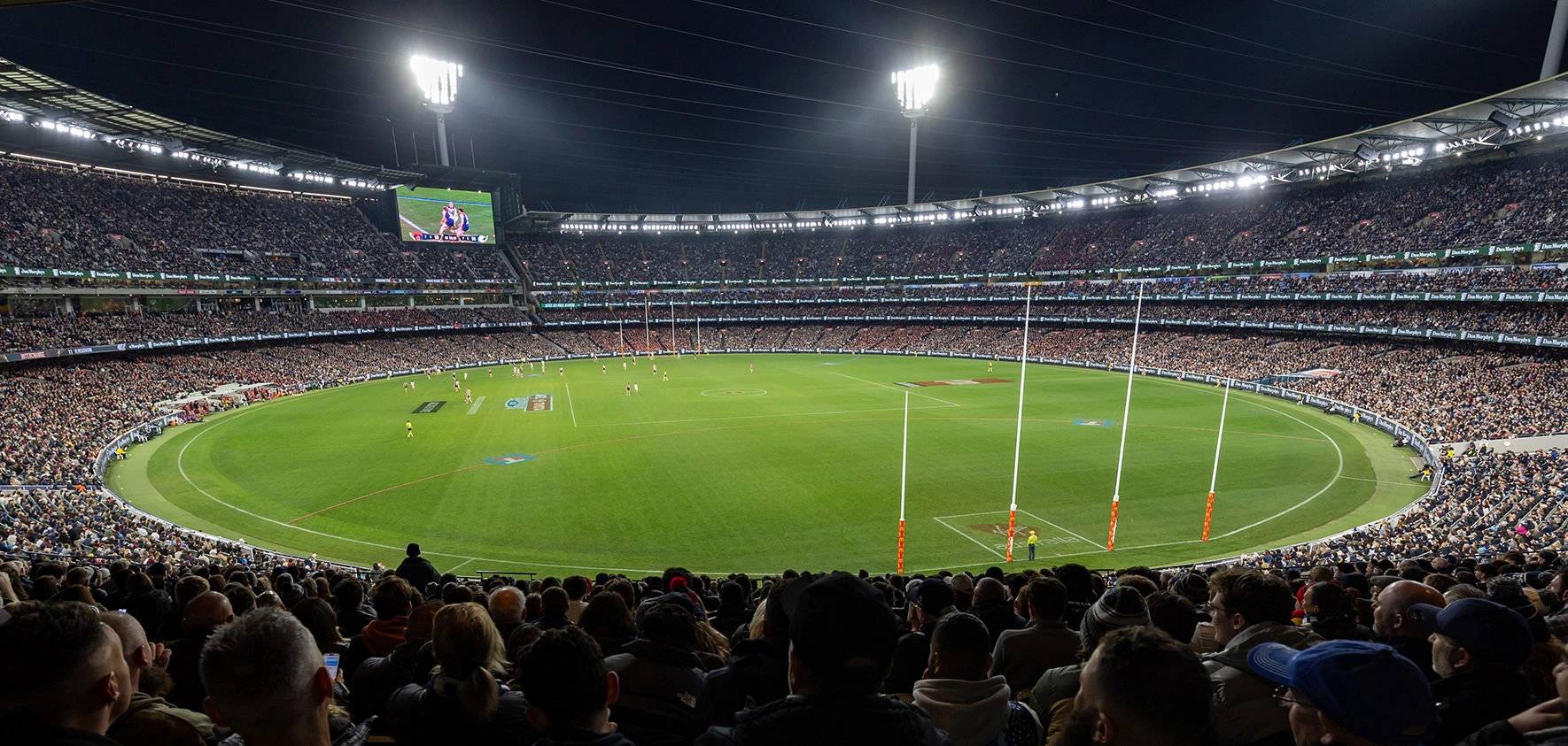 MCG arena under lights during an AFL match