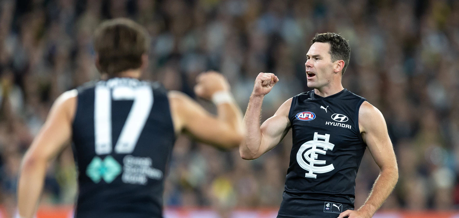 Carlton player celebrates on field
