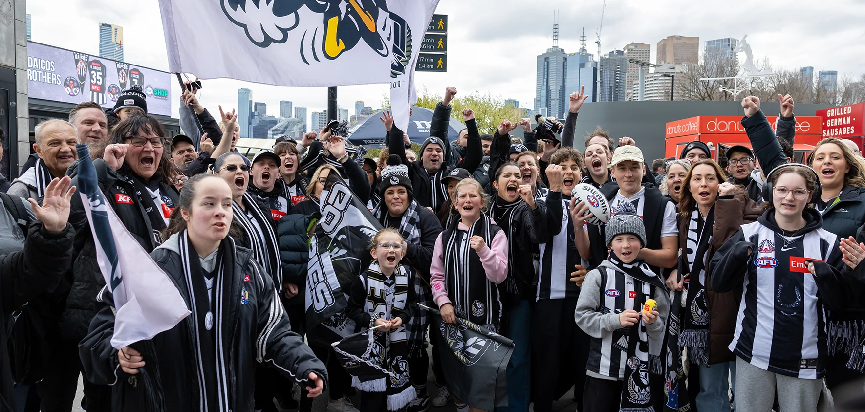 Collingwood fans cheer on MCG concourse