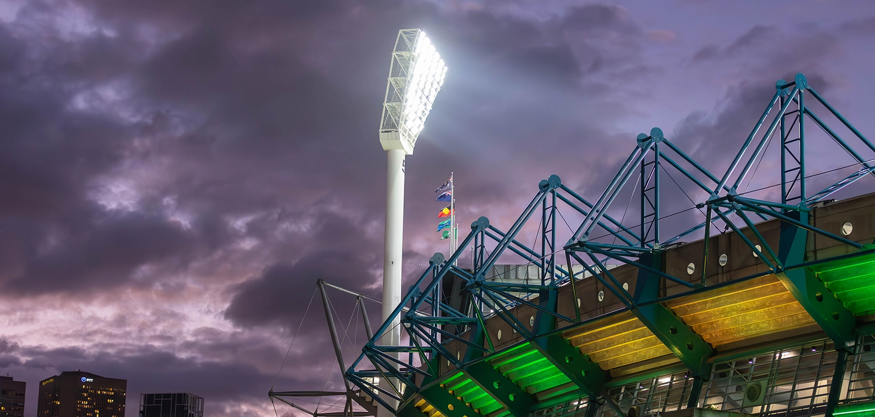 The exterior of the MCG lit up in green and gold for the Bledisloe Cup