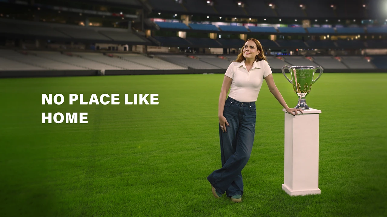 No Place Like Home Georgie Tunny stands on the MCG next to the 2026 AFL Premiership Cup