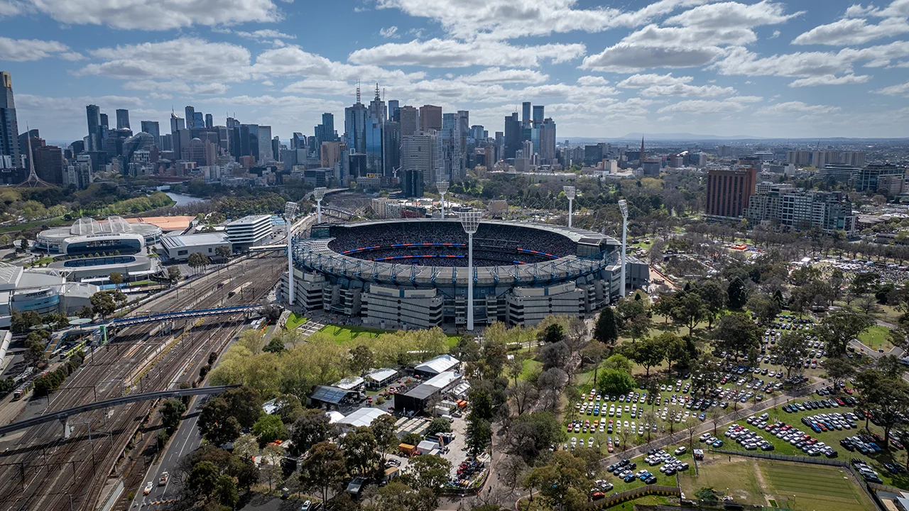 Aerial view of MCG, city skyline and railway lines